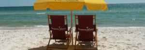 An image of beach chairs that are at a resort near shops in Panama City Beach.