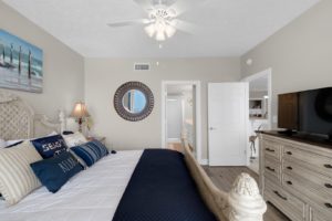 The bedroom of a Panama City Beach condo rental to relax in after swimming with dolphins.