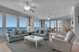 The living room of a Panama City Beach condo that's near top attractions, like bars.